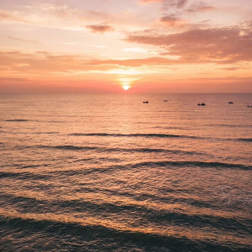 Golden sunset over a calm ocean with gentle waves